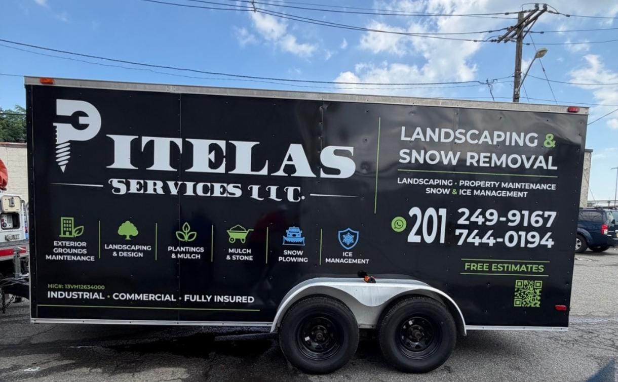 Pitelas Services LLC trailer with completed black commercial lettering and graphics