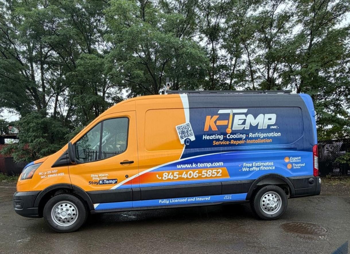 K-Temp Inc service van with completed orange and blue HVAC wrap
